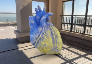 Yellow blue heart AR capture at high-rise rooftop